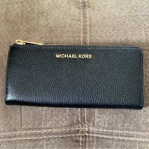 Michael Kors “Bedford” 3/4 zip leather wallet. Brand new